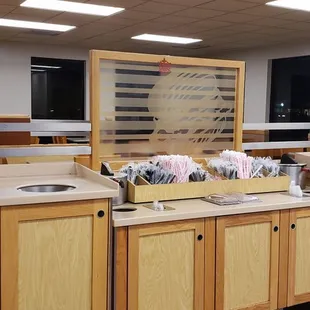a kitchen with wooden cabinets and counter tops