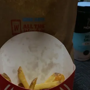 a woman&apos;s face in a paper cup