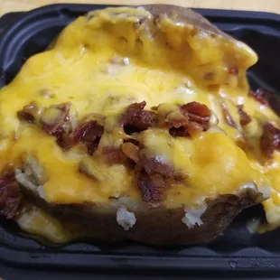 Baked potato with cheese &amp; bacon.