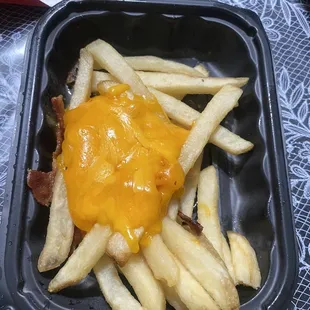 Ordered Baconator Fries and was very disappointed to see how it was made .