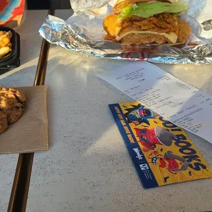a sandwich and a bag of chips on a table