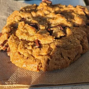 a chocolate chip cookie on a napkin