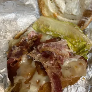 Old lettuce and raw NOT crispy bacon.  Yuck.