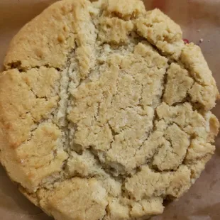 a peanut butter cookie on a piece of wax paper
