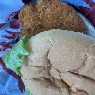 a fried chicken sandwich with lettuce