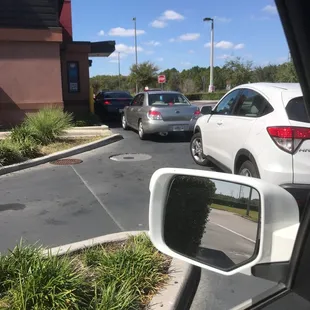 a view of a parking lot from inside a car