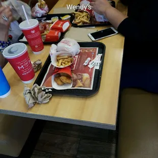a couple of people eating at a table