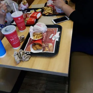 a woman and a child eating at a table