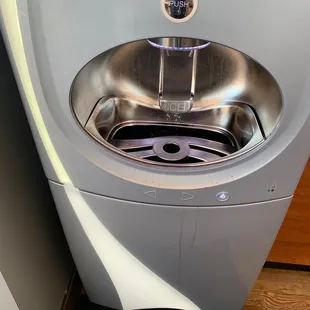 a stainless steel sink in a bathroom