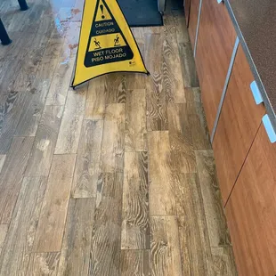 a caution sign on the floor