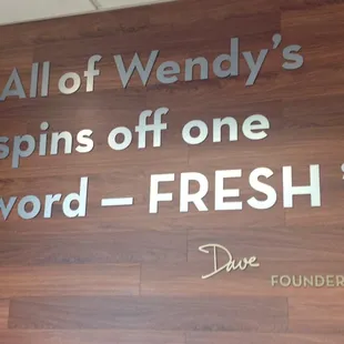 a sign that says,&apos;all of wendy&apos;s spins off one word - fresh &apos;