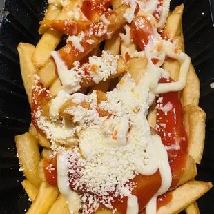 Papas Locas! Crazy Fries with loaded with mayonnaise, cheese, and Catchup