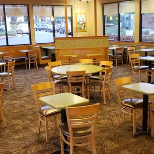 empty tables and chairs in a restaurant