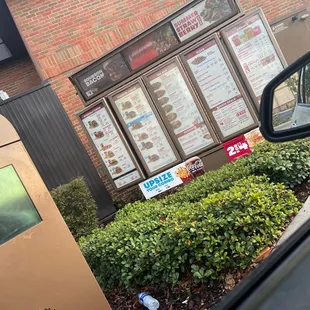 a menu in a window of a restaurant