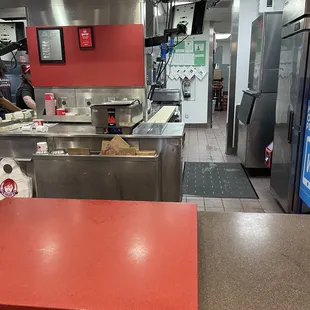 a kitchen with a red counter top