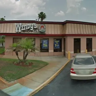 a car parked in front of the restaurant