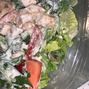a salad in a plastic container