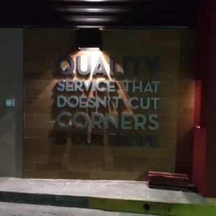 a sign that says quality service that doesn't cut corners