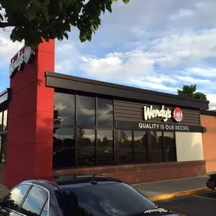 a car parked in front of a restaurant