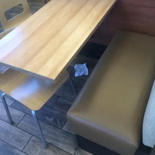 a table and bench in a restaurant