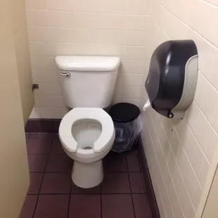 a toilet in a public restroom