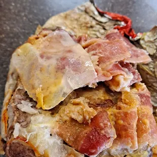 a sandwich with meat and cheese