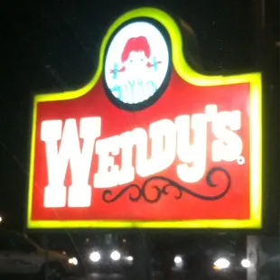 a neon sign for wendy's