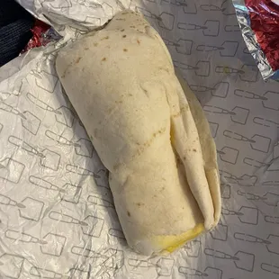 Breakfast burrito, bursting from each end