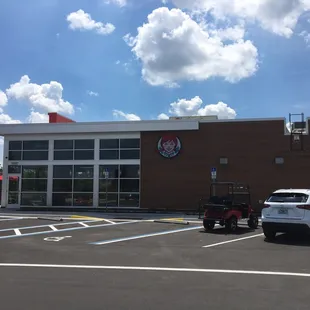 a car parked in front of a restaurant