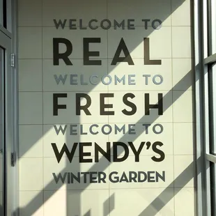 a welcome sign on a wall
