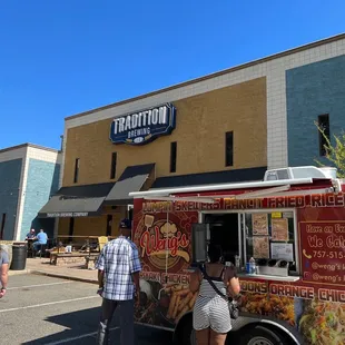 people ordering food from a food truck