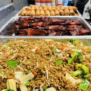 Vegetable fried rice, teriyaki, chicken skewer, chicken eggrolls