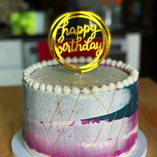Chocolate Fudge Cake. Filled with Banana Cremeux and Marshmallow filling. Finished with Vanilla Buttercream