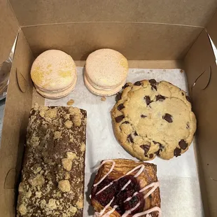 Carrot loaf, chocolate chip cookie, blackberry tart, and macaroons