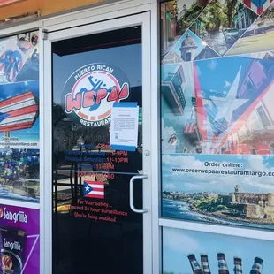 Door closer to parking lot. They have a street entrance too. Hours if u zoom in.