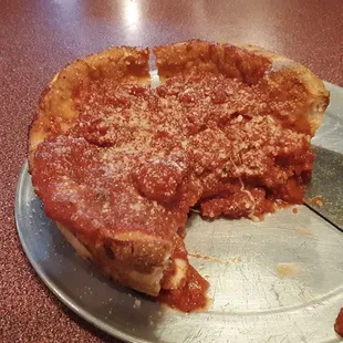 Small stuffed pizza w/ spinach &amp; onions.