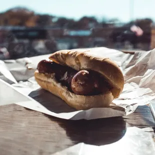 a hot dog on a bun