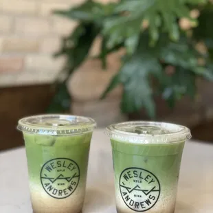 two cups of green tea on a table