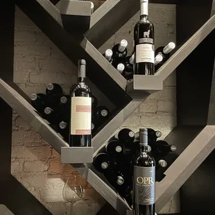 a wine rack with bottles of wine