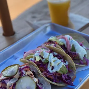 Nashville hot chicken taco (left) shrimp taco (middle and right)