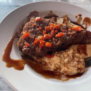 The frog chop  and grits cannot be out done, but my wife also  loves the ribs with a side of grits