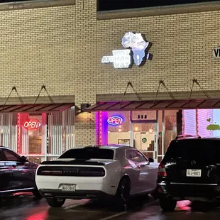 cars parked in front of a store