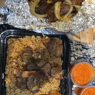 a meal of meat, rice and carrots