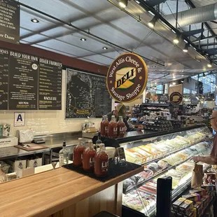 Deli section all the way around corner huge selection of cheese as sausages and jerky