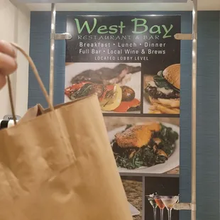 a person holding a paper bag