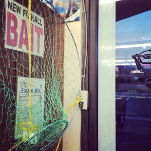 a fishing net hanging on a wall