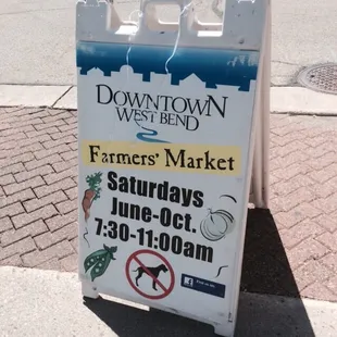 a sign on the sidewalk