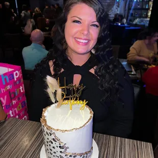 a woman with a birthday cake