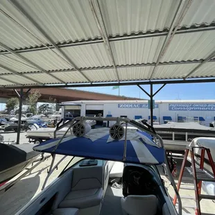 Bimini top with wake board pockets