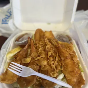 a fork in a plastic container